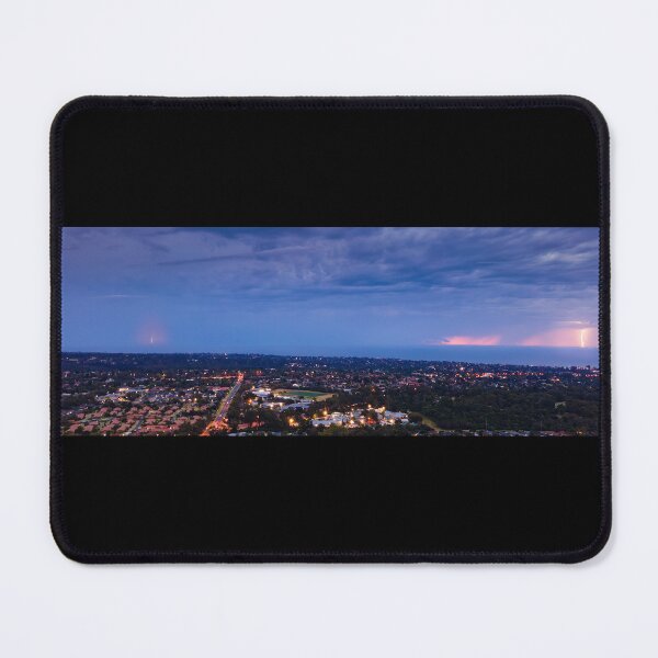 Item preview, Distant lightning strikes across Port Philip Bay seascape filled with stormy clouds and street lights aerial panoramic designed and sold by James-Cole.