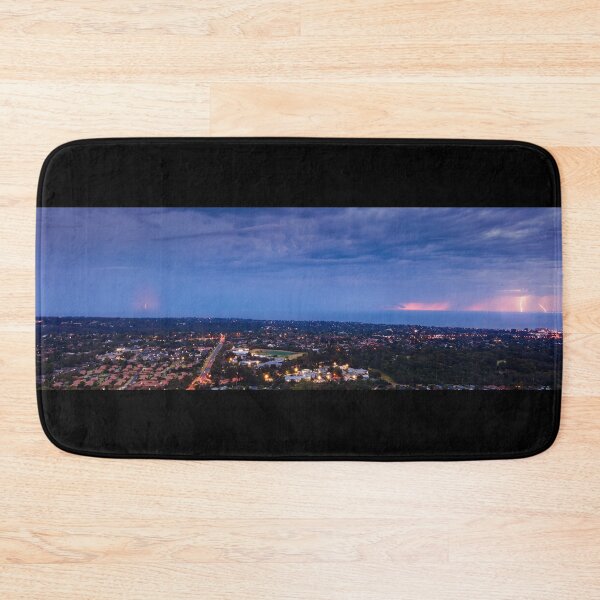 Item preview, Distant lightning strikes across Port Philip Bay seascape filled with stormy clouds and street lights aerial panoramic designed and sold by James-Cole.