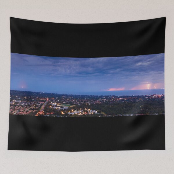Item preview, Distant lightning strikes across Port Philip Bay seascape filled with stormy clouds and street lights aerial panoramic designed and sold by James-Cole.