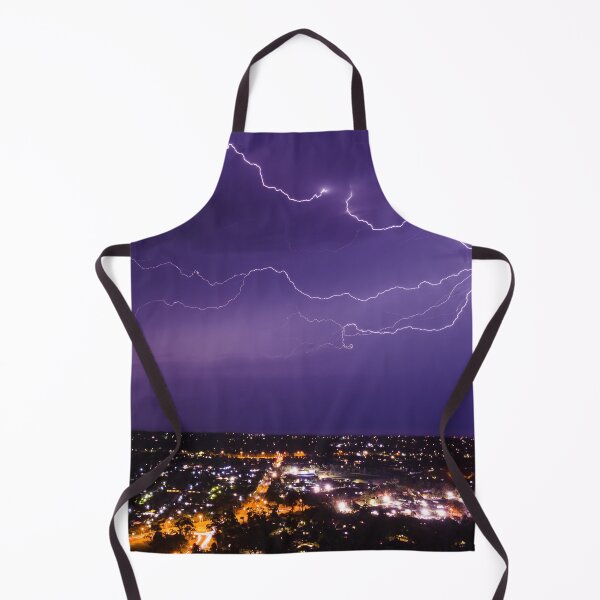 Item preview, Lightning bolt discharging in the stormy clouds above the street lights aerial nighttime shot designed and sold by James-Cole.