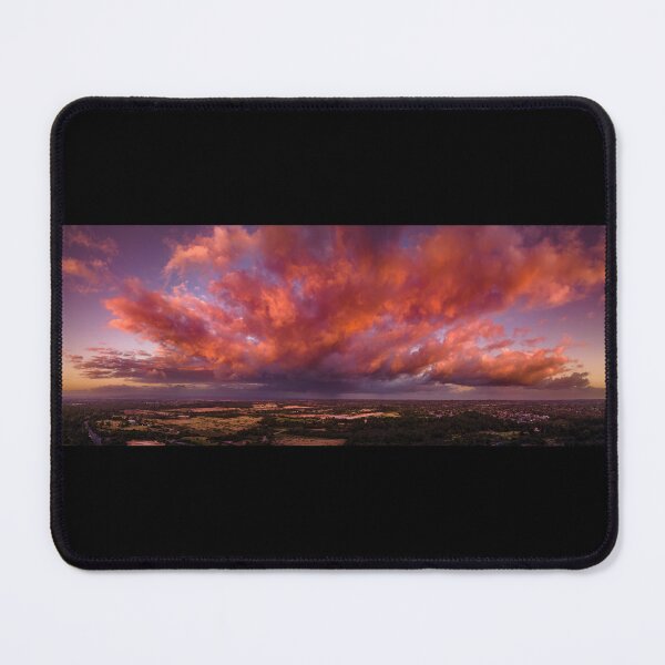 Item preview, Firey storm clouds orange pink and red at sunset with distant rain storm across the landscape aerial panoramic designed and sold by James-Cole.