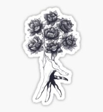 Hand with lotuses on black Sticker