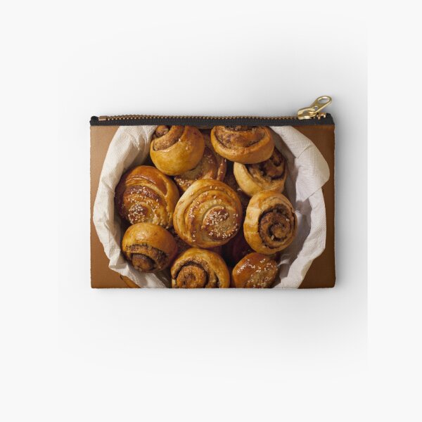 Item preview, Full basket of sweet bread rolls with cinnamon and sesame seeds  designed and sold by mrivserg.