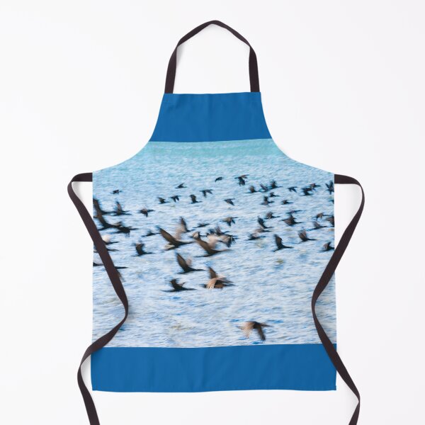 Item preview, Flight of cormorant blurred in motion in flight over blue water designed and sold by Brian Scantlebury.