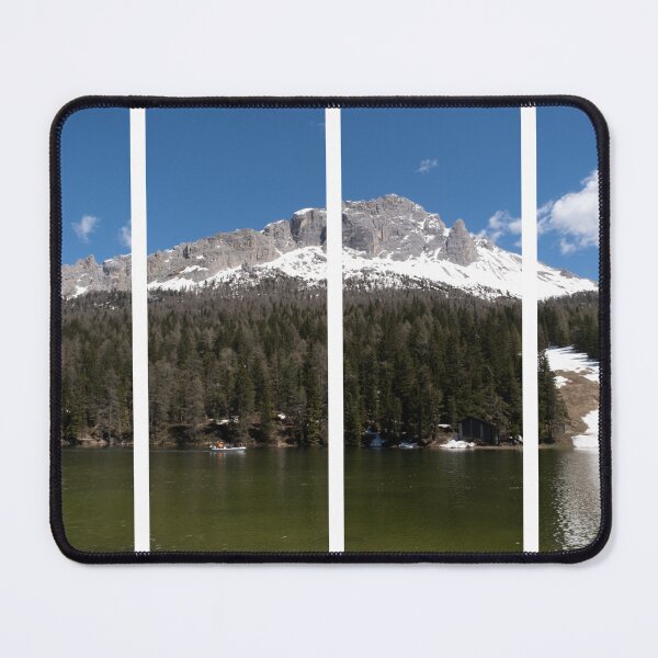 Item preview, The fabulous alpine lake of Misurina in the Dolomites. Boat on the water. Lovely and relaxing place in the Italian Alps. Reflections in the rippled water. Sunny spring day. designed and sold by Maurizio Fabbroni.
