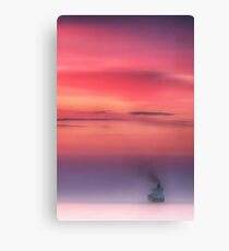Cargo ship enters the night. Canvas Print
