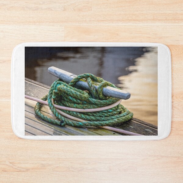 Item preview, Rope tied around a metal bollard mooring on a wooden jetty designed and sold by SnapTPhotograph.