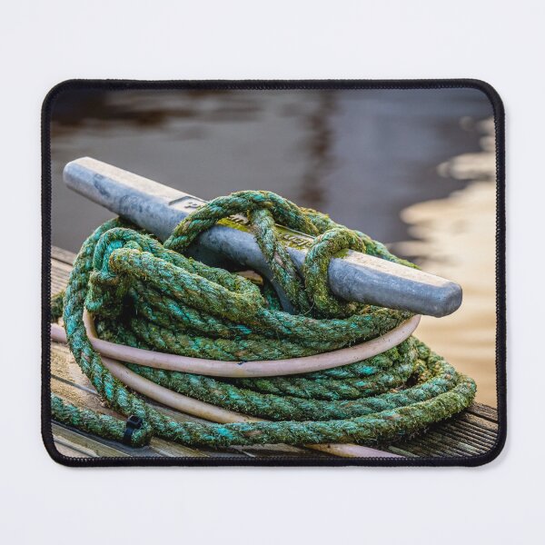 Item preview, Rope tied around a metal bollard mooring on a wooden jetty designed and sold by SnapTPhotograph.