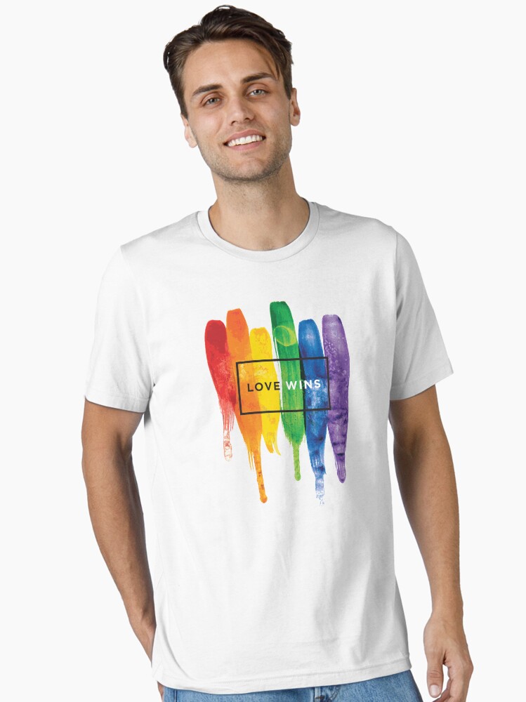 Thumbnail 2 of 7, Essential T-Shirt, Watercolor LGBT Love Wins Rainbow Paint Typographic designed and sold by LGBTIQ.