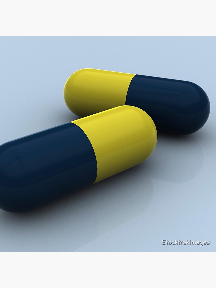 Blue and yellow medication capsules. by StocktrekImages