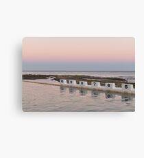 Sunset over ocean pool Canvas Print
