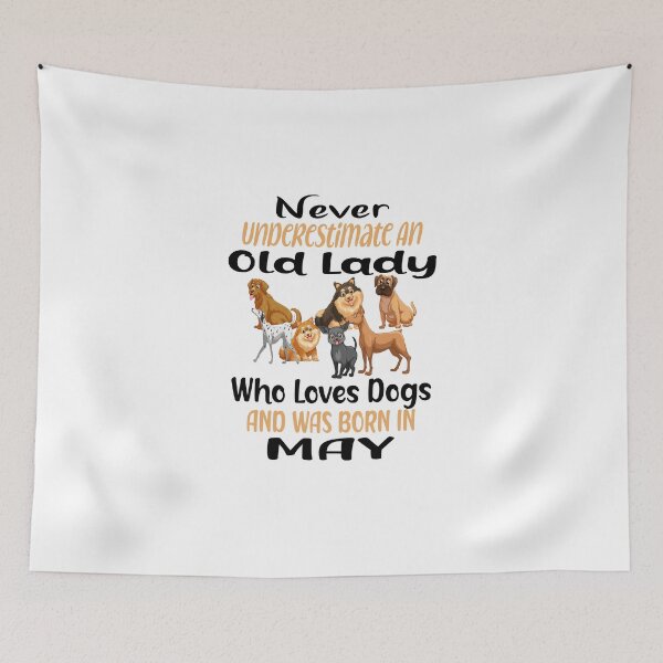 Item preview, Never Underestimate An Old Lady Who Loves Dogs And Was Born In May designed and sold by boyastore.