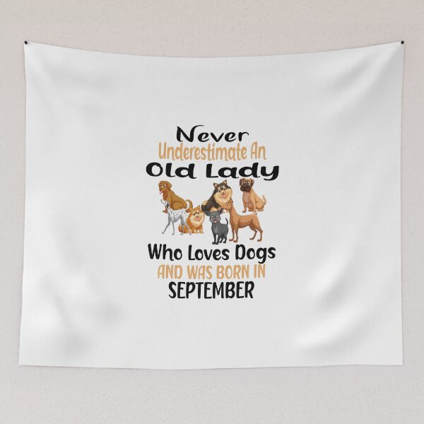 Item preview,  Never Underestimate An Old Lady Who Loves Dogs And Was Born In September designed and sold by boyastore.