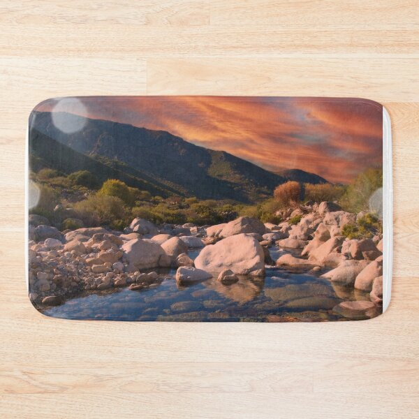 Item preview, Sunrise mountains over rocky river designed and sold by hardscuffle.