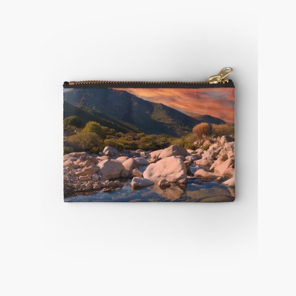 Item preview, Sunrise mountains over rocky river designed and sold by hardscuffle.