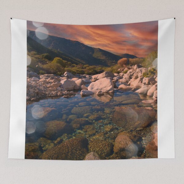 Item preview, Sunrise mountains over rocky river designed and sold by hardscuffle.