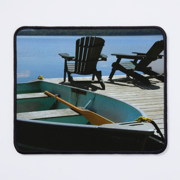 Item preview, Dock with Adirondack Chairs and green boat at lake designed and sold by hardscuffle.