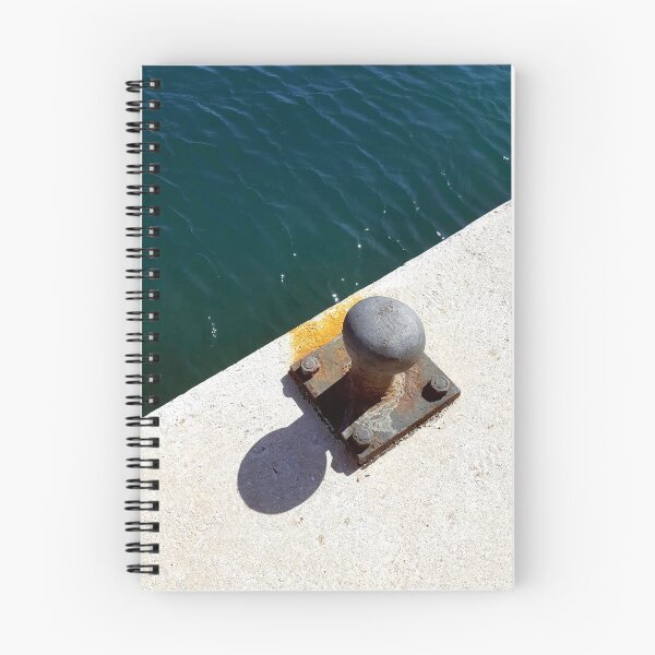 Item preview, Rusty boat bollard by a deep azure blue sea. designed and sold by janesg.
