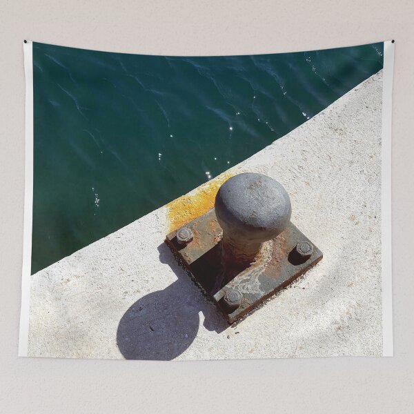 Item preview, Rusty boat bollard by a deep azure blue sea. designed and sold by janesg.