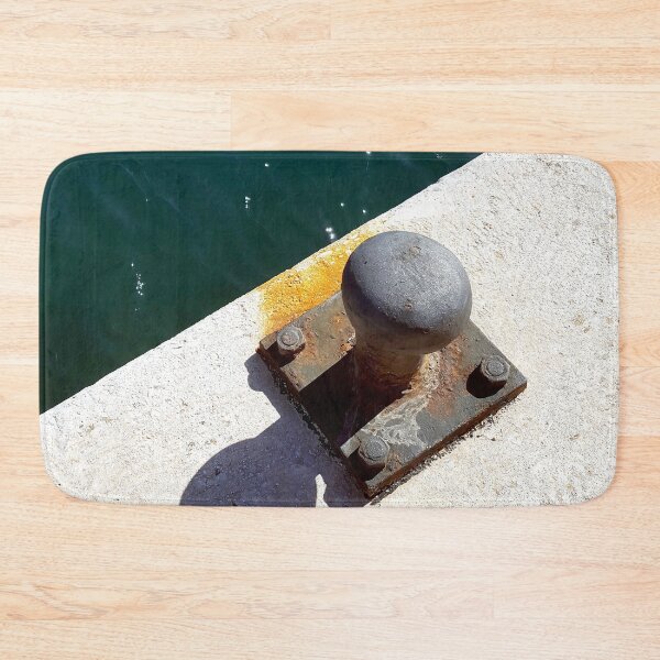 Item preview, Rusty boat bollard by a deep azure blue sea. designed and sold by janesg.