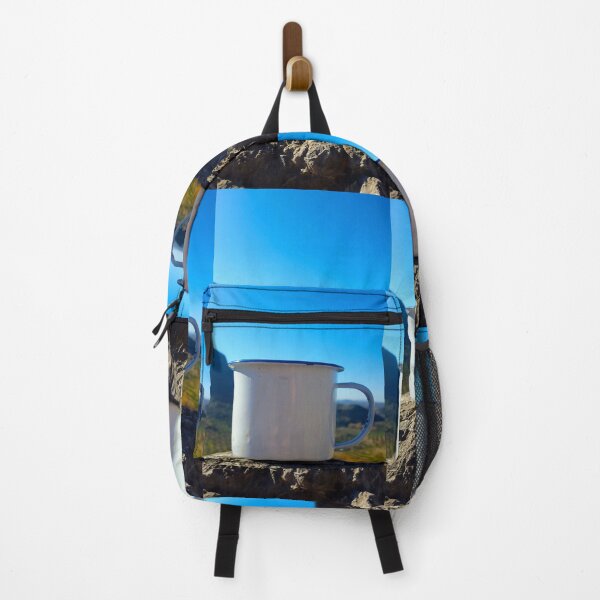Item preview, A white enamel metal camping mug sat on a rock with mountain and blue sky. designed and sold by janesg.