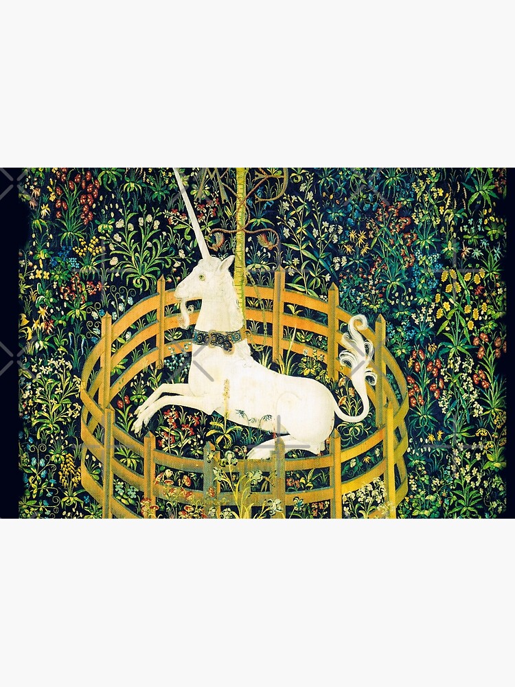 The unicorn rests online in a garden tapestry