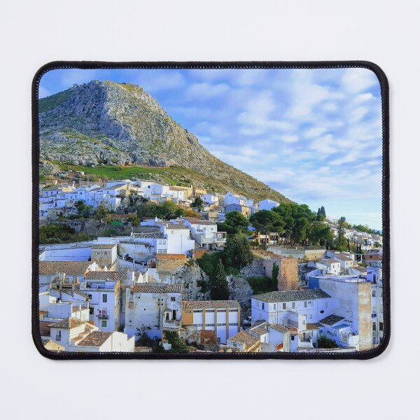 Item preview, Tradidional Spanish white village with white houses, mountain with castle and blue cloudy sky. designed and sold by janesg.