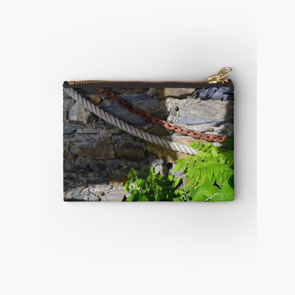 Item preview, Green plant growing in front of stone wall. designed and sold by oanaunciuleanu.