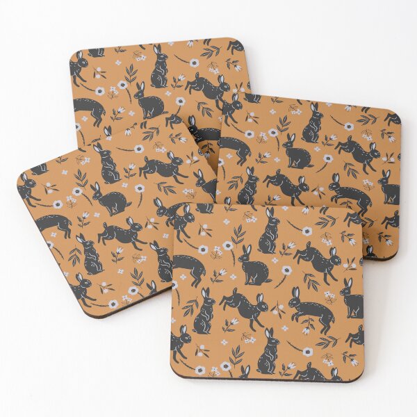 Item preview, pattern with black rabbits and flowers on an orange background designed and sold by burbura.