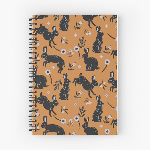 Item preview, pattern with black rabbits and flowers on an orange background designed and sold by burbura.