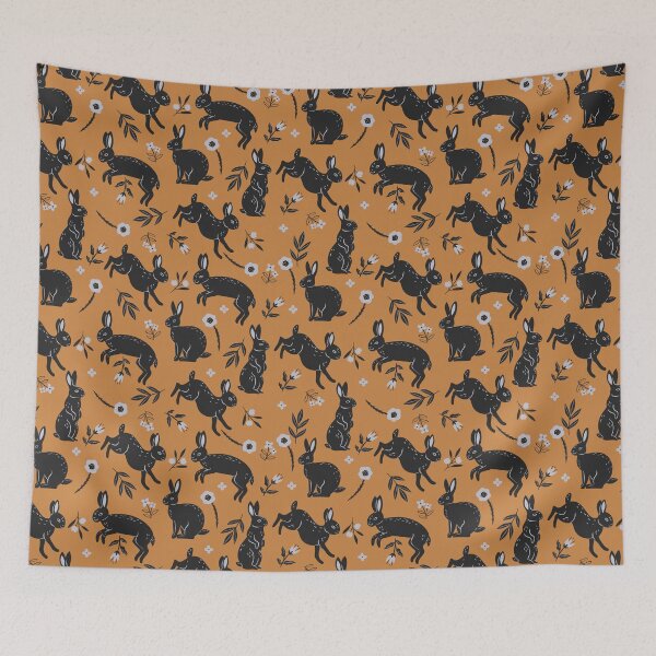 Item preview, pattern with black rabbits and flowers on an orange background designed and sold by burbura.