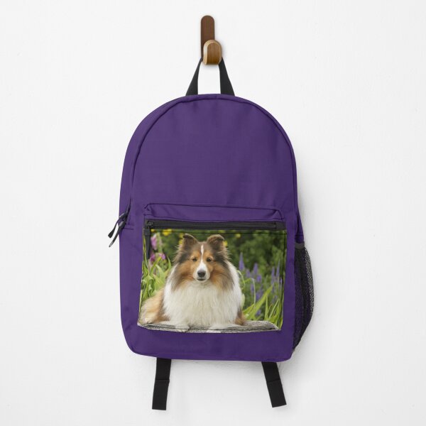 Artikelvorschau, Wunderschöner Shetland Sheepdog auf einem Felsen in einem Blumengarten. entworfen und verkauft von ScienceSource.