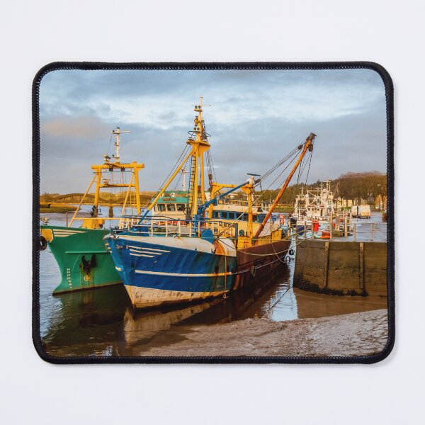 Item preview, Fishing trawlers moored at Kirkcudbright harbour on the River Dee at sunset in winter, Dumfries and Galloway, Scotland designed and sold by SnapTPhotograph.