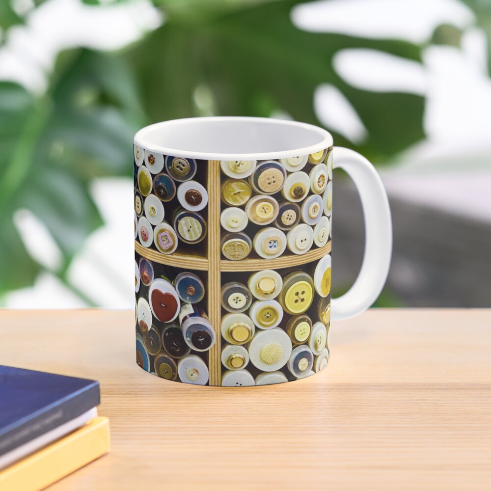 Button tubes sale display warm colors Taza de café