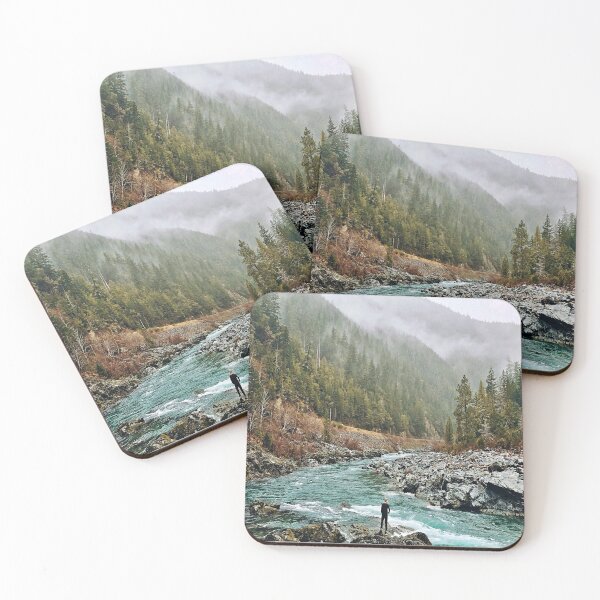 Item preview, Forest Photography - A man standing on jagged rocks in a fast-flowing river in the wilderness designed and sold by Tjokko-chan.