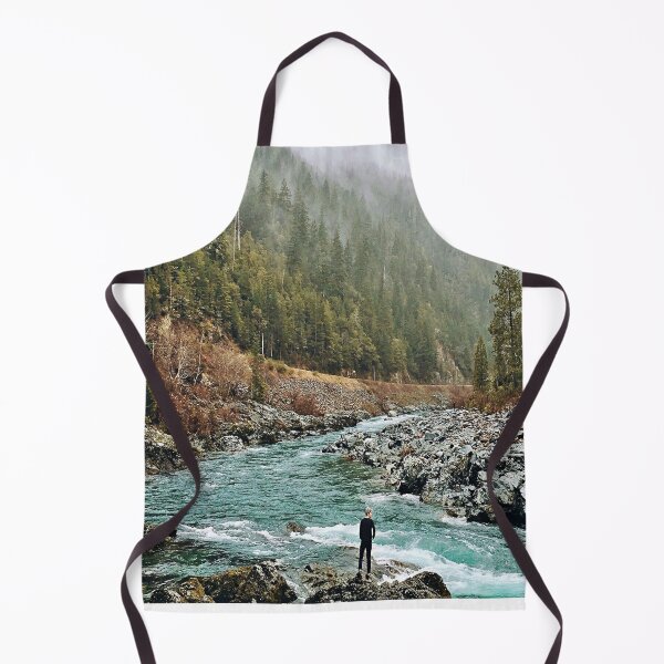 Item preview, Forest Photography - A man standing on jagged rocks in a fast-flowing river in the wilderness designed and sold by Tjokko-chan.