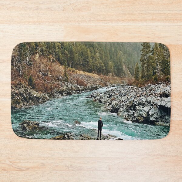 Item preview, Forest Photography - A man standing on jagged rocks in a fast-flowing river in the wilderness designed and sold by Tjokko-chan.
