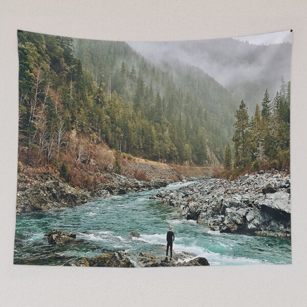 Item preview, Forest Photography - A man standing on jagged rocks in a fast-flowing river in the wilderness designed and sold by Tjokko-chan.
