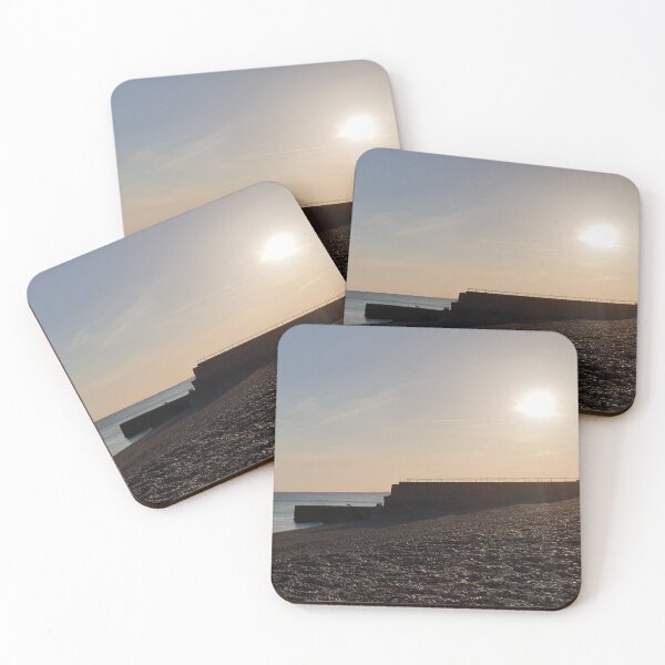 Item preview, Sunset on a pebbled beach designed and sold by Thought2reality.