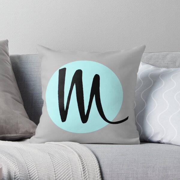 Lettre M dans un cercle Coussin