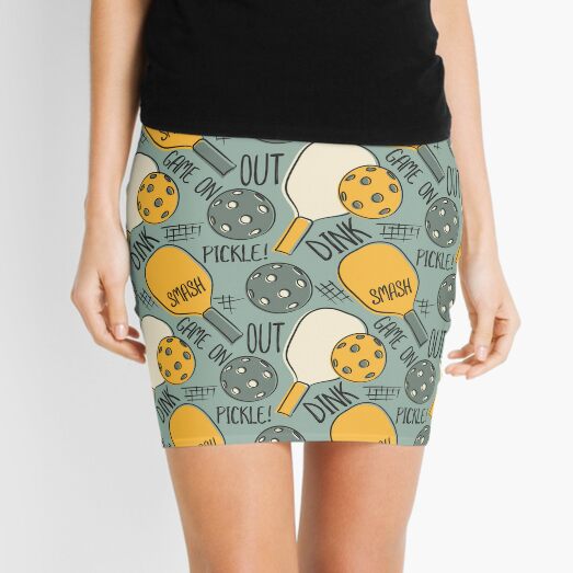 Pickleball design with Cyan, Green, Orange, Pink or Stars Pickleballs.  Women's skort-skirt with shorts.