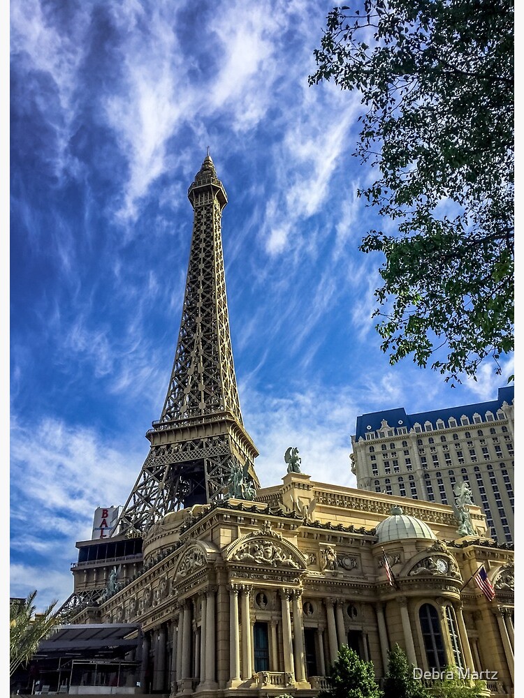 View across lake to replica Eiffel Tower at the Paris Hotel and Casino,  Bellagio fountains in