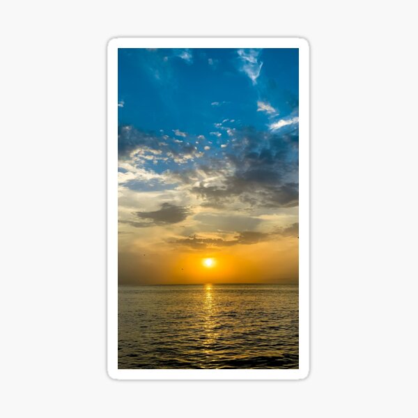 sunset by the sea Sticker