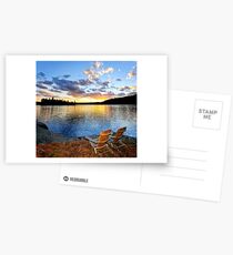 Wooden chairs at sunset on beach Postcards