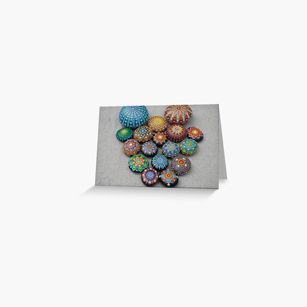 Mandala painted stones on sand. Greeting Card