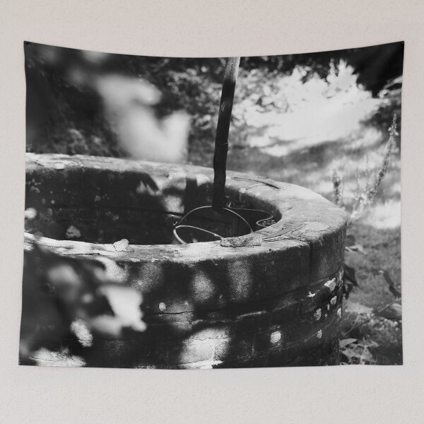 Item preview, Black and white photo of an old well at an authentic Dutch farm in the Netherlands designed and sold by Diana van Neck.