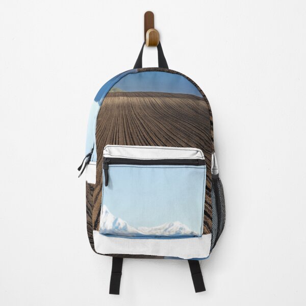Item preview, plowed field and mountains in distance landscape designed and sold by goceris.