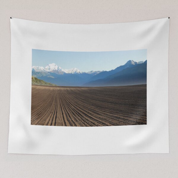 Item preview, plowed field and mountains in distance landscape designed and sold by goceris.