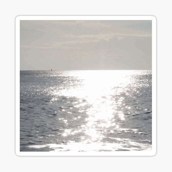 Sunlight sparkles on the sea Sticker