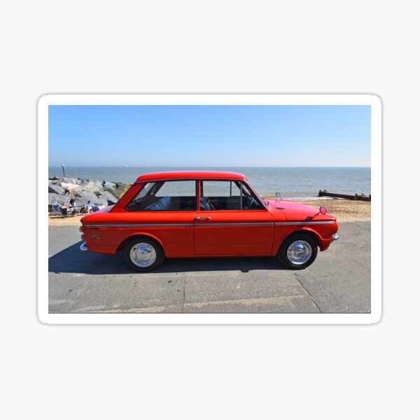 "Classic Orange Ford Cortina MK3 Car Parked in front of beach huts
